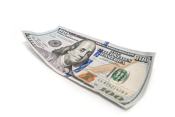 istock one hundred dollar closeup on white background 492994508