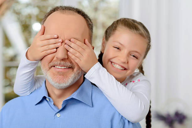 istock Grandfather sitting with his grandchild 492995228