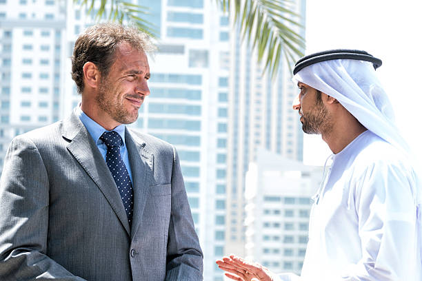 istock Middle eastern businessmen meeting western man 492995766