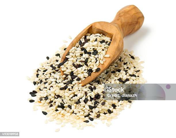 Black And White Sesame Seeds Isolated On White Background Stock Photo - Download Image Now