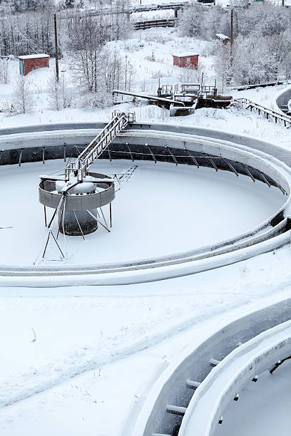 istock Snow-covered empty round settlers in sewerage treatment plant 493020928