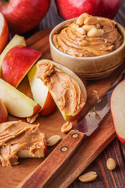 istock Red apples and peanut butter for snack 493021180
