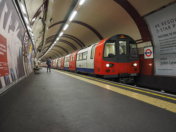 Tube train at platform in London stock photo