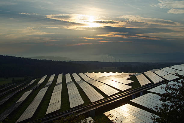 istock Sunset over the solar power plant between forests. 493024698