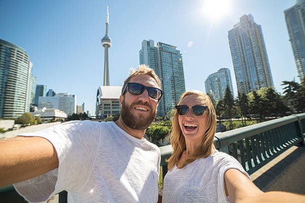 Two young adults taking selfie portrait in Toronto