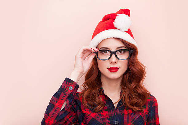 Girl in Santa Claus hat stock photo