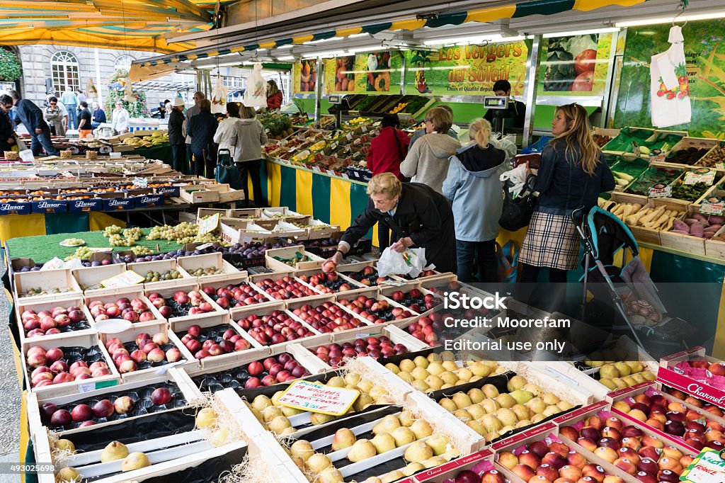 Fruit Stall With People Buying At Morlaix Weekly Market France