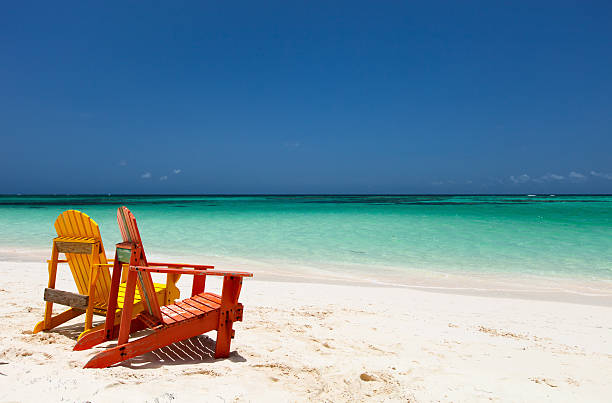 istock Colorful lounge chairs at Caribbean beach 493025704