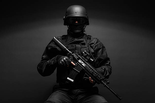 istock police officer with weapons 493027546