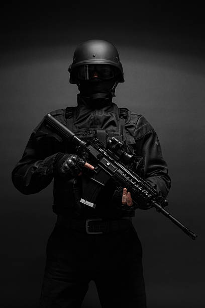 istock police officer with weapons 493027586