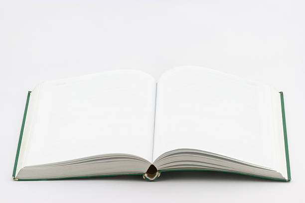 istock Used open empty book with green cover on white background 493027640
