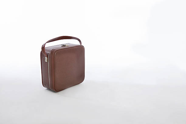istock brown retro vintage suitcase isolated on a white background 493029280