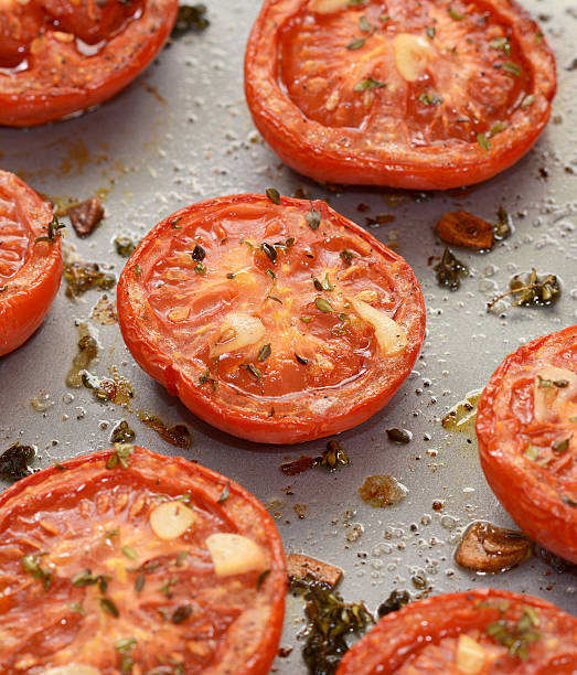 istock Roast tomatoes, seasoned with thyme and garlic 493030864