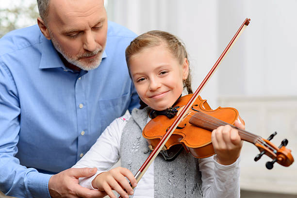 istock Nice girl playing the violin 493031716