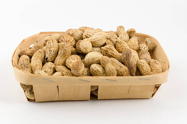 istock wooden container is filled with pistachios on a white background 493031874