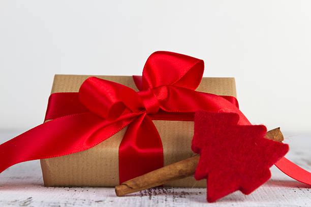 Gifts gift wrapped with a red bow schenken stock pictures, royalty-free photos & images