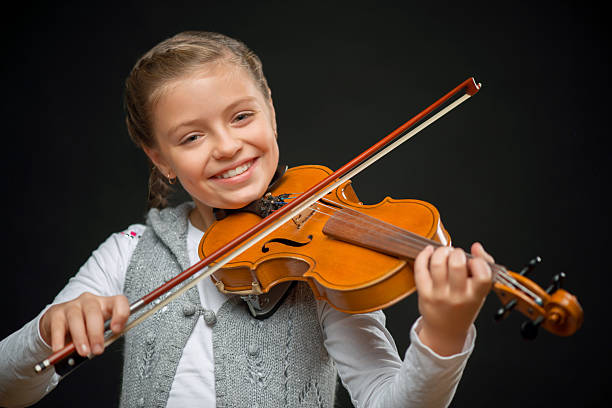istock Nice girl playing the violin 493032100