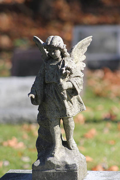 istock Angel atop a child's tombstone 493033070