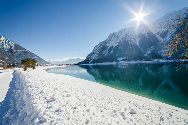 istock Winter landscape with mountain lake 493052544