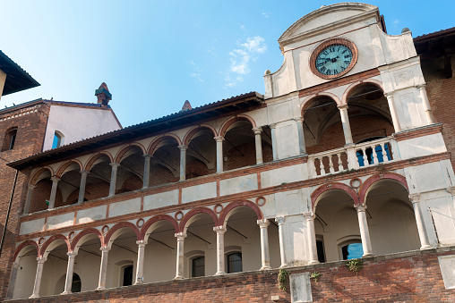 Pavia (Lombardy, Italy), historic buildings at morning: facade of the medieval Broletto