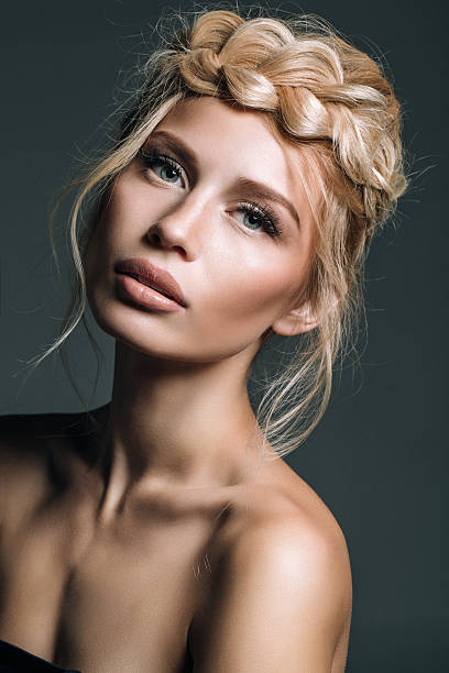 istock Beautiful woman on dark background 493053410