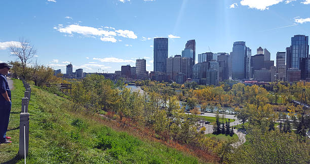 istock Man Looking Out To Calgary's Beautiful Fall Skyline 493054104