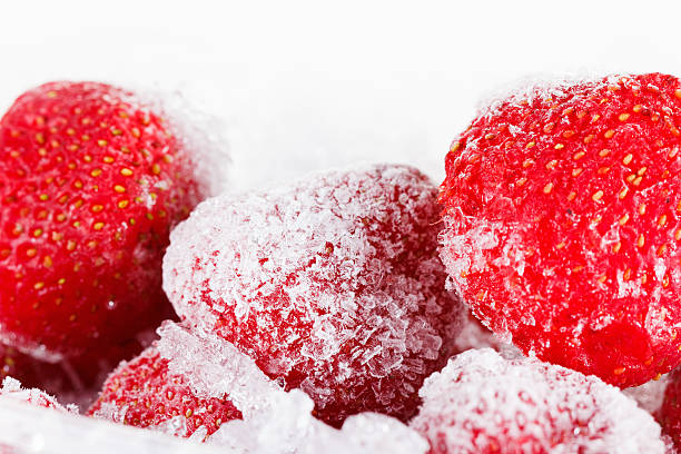 istock Strawberries, frozen for long term storage on white background 493055386