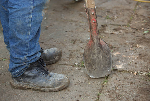 Posthole digger used for digging holes for fencing posts