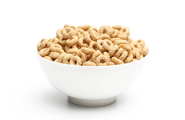 Breakfast Cereal Breakfast cereal isolated on a white background bowl stock pictures, royalty-free photos & images