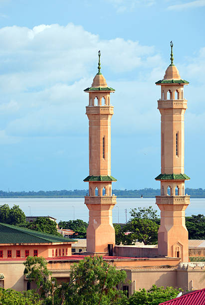 King Fahah mosque, Banjul Banjul, The Gambia: minarets of the King Fahad mosque seen against the River Gambia - Box Bar Road, former Wallace Cole Road - photo by M.Torres banjul stock pictures, royalty-free photos & images