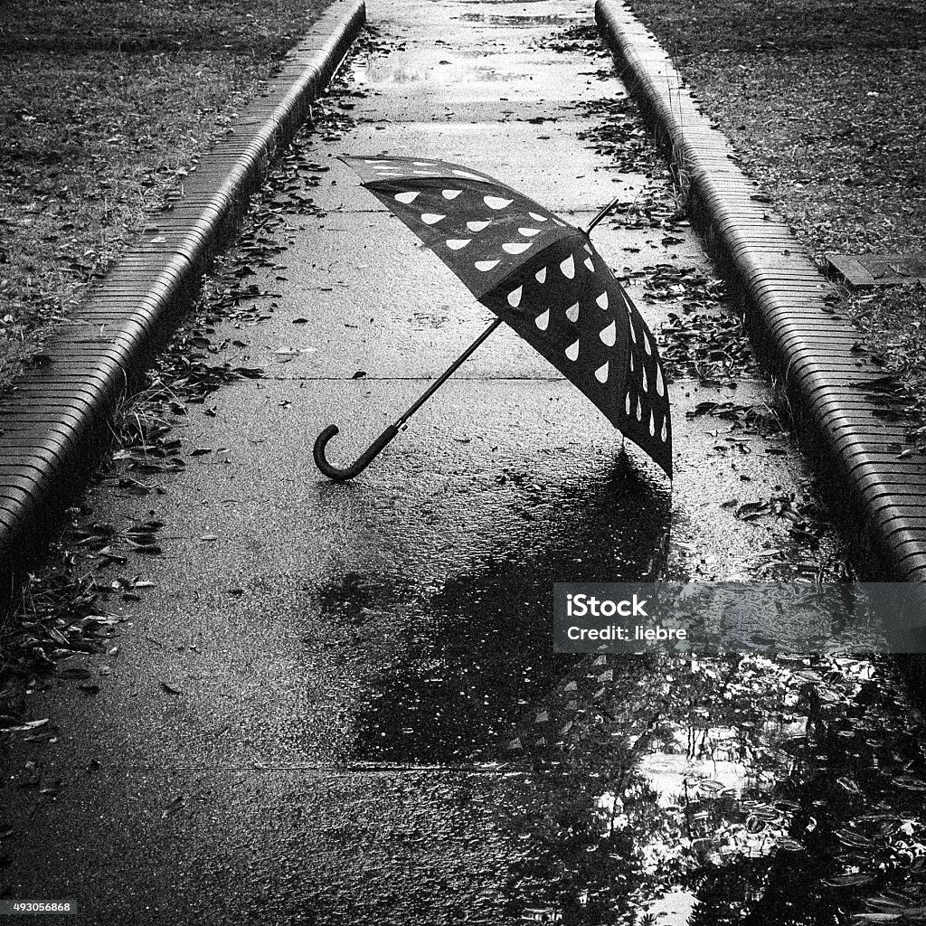 Umbrella that has been placed in solitary Umbrella that has been placed in solitary. Rain Stock Photo
