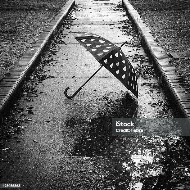 Umbrella That Has Been Placed In Solitary Stock Photo - Download Image Now - Rain, Sadness, 2015