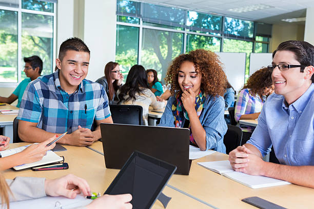 istock Happy diverse group of high school or college students studying 493057816