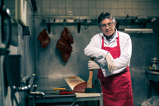 portrait of a butcher portrait of a butcher meat packing industry photos stock pictures, royalty-free photos & images