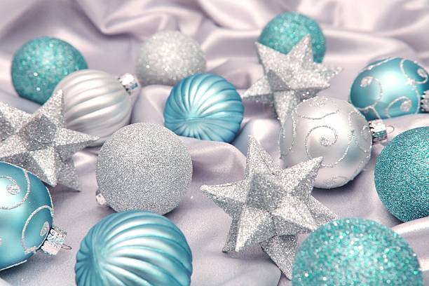 istock Holiday: Turquoise or aqua and silver Christmas ornaments on satin 493060072
