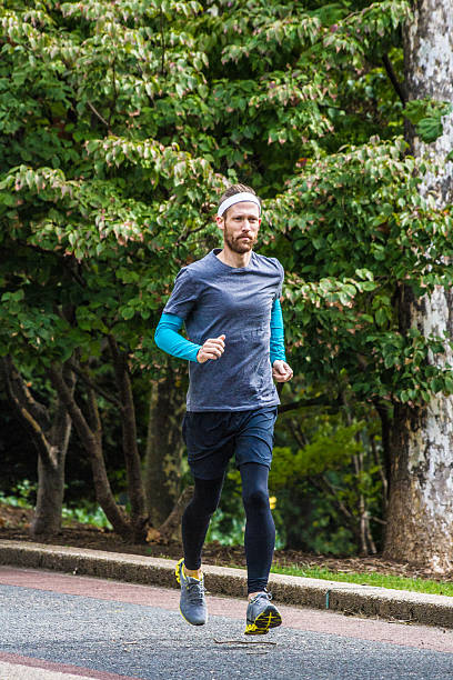 istock Male Running in the Park 493060214