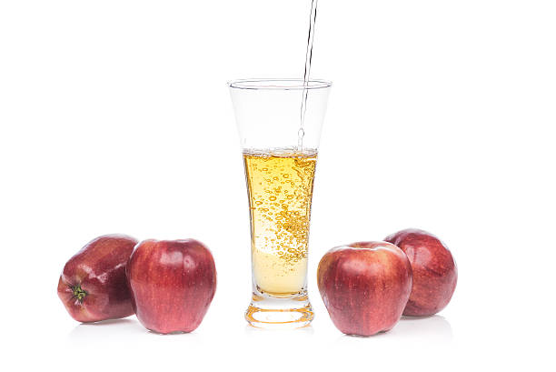 istock Fresh apple juice pouring into glass 493061082