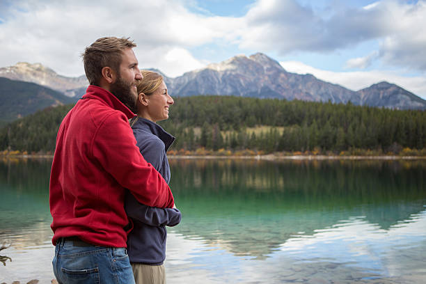 istock Two young adults by the lake enjoying nature 493063068