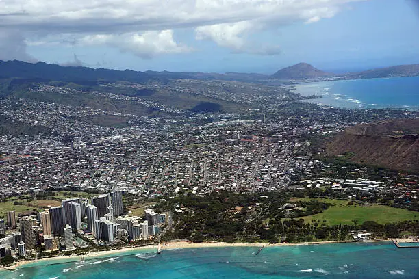 Aerial view of Diamondhead, Kapiolani Park, Waikiki, Ala Wai Canal, Kapahulu town, Pacific ocean, clouds, Kahala and Golf Course on Oahu, Hawaii.