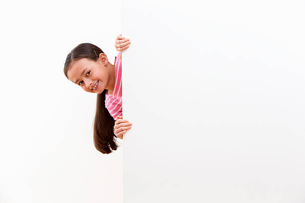 Girl With Cheeky Face Looking Around White Wall In Studio Girl With Cheeky Face Looking Around White Wall In Studio looking around stock pictures, royalty-free photos & images
