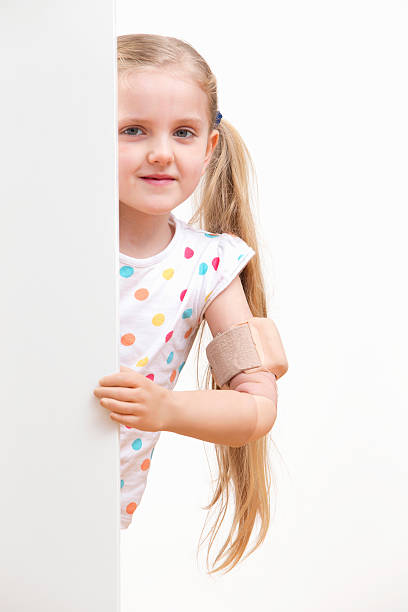 istock Disabled Girl Looking Around White Wall In Studio 493070793