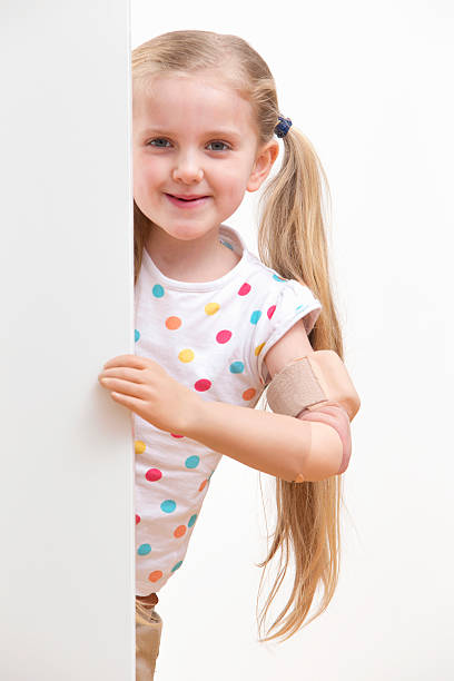 istock Disabled Girl Looking Around White Wall In Studio 493070795