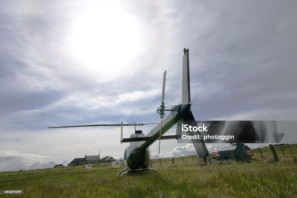 Rear View of Helicopter Rear view of a private charter helicopter awaiting passengers for a scenic tour of the west of Scotland. Aerospace Industry Stock Photo