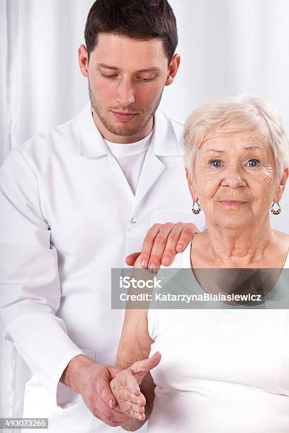 Physiotherapist Checking Arm Motor Abilities Stock Photo - Download Image Now - Adult, Alternative Therapy, Care