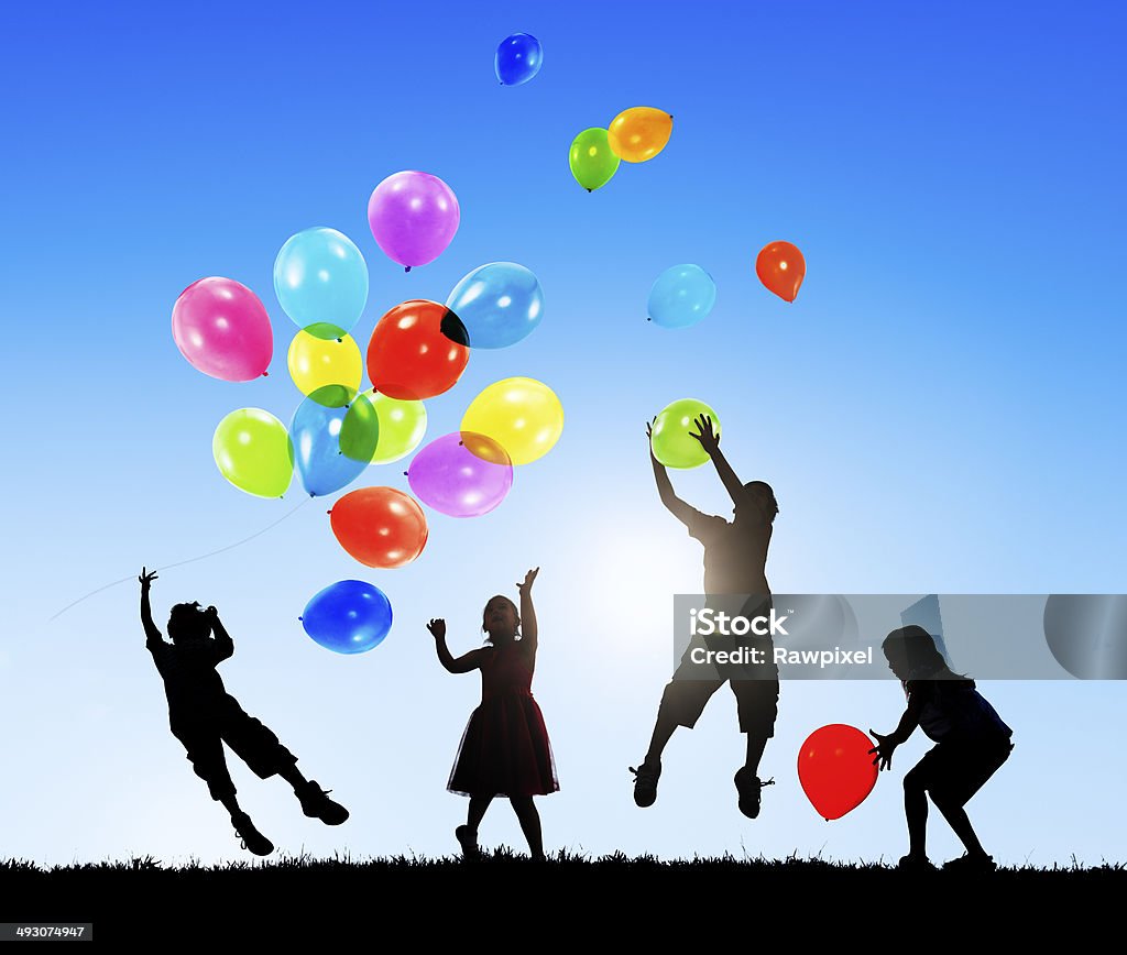 Children Outdoors Playing Balloons Together Balloon Stock Photo