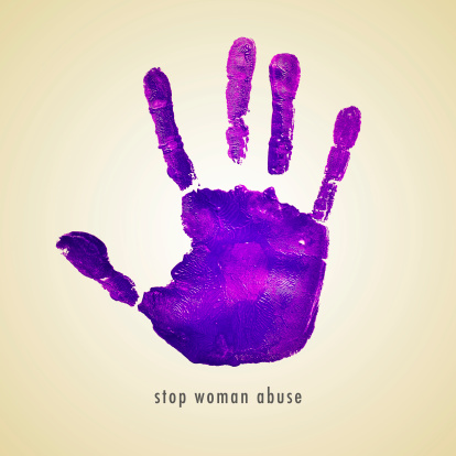 sentence stop woman abuse and a violet handprint on a beige background