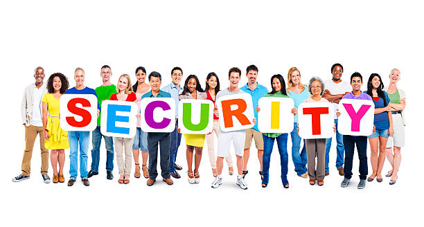 istock Multiethnic Group Of People Holding Alphabet To Form Security 493075237