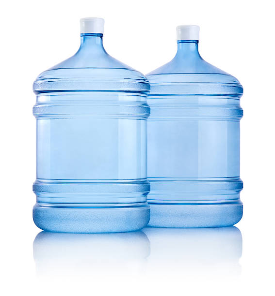 istock Two big bottles of water isolated on white background 493075911