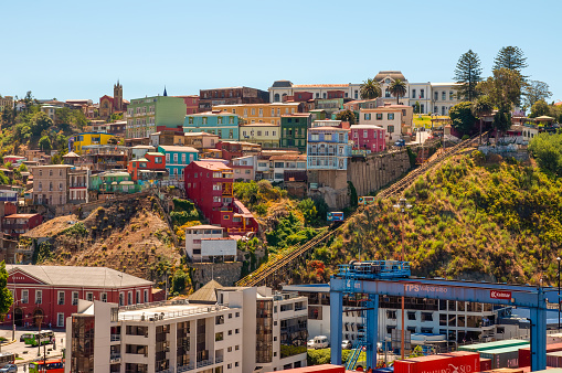 Valparaiso, Chile - December 3, 2012: Two cars of Funicular in Valparaiso, Chile against background of colorful houses in Cerro Artilleria. 