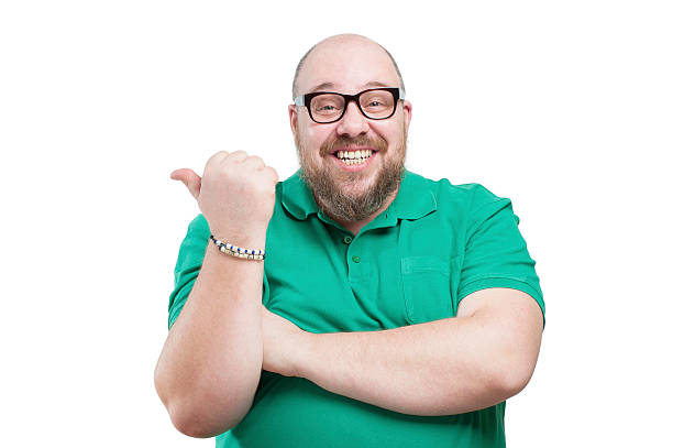 istock Smiling man shows his finger to the side. 493078976